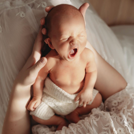 baby wearing knit alpaca bloomers